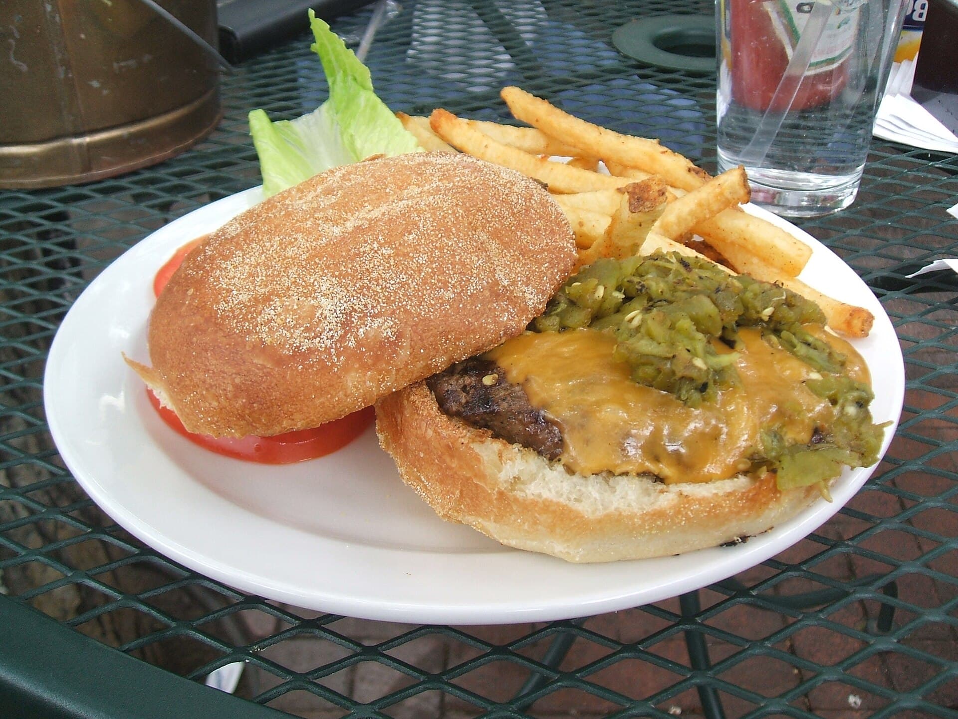 A green chile cheeseburger with fries